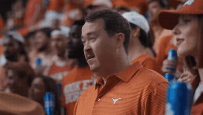 Man In Green Nike Sweatshirt Sitting At Microphone GIF