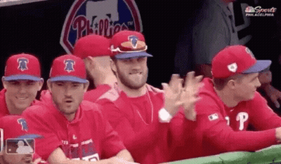 Man In Green Oakland Jersey In Front Of Sign Saying 367 GIF