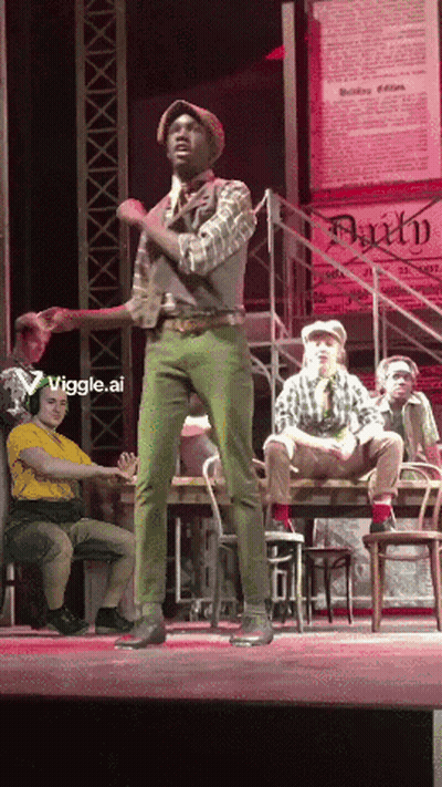 Man In Green Pants On Stage With Faith Sign GIF