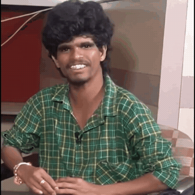 Man In Green Plaid Shirt Smiling GIF