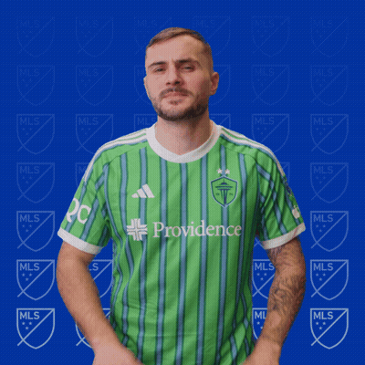 Man In Green Providence Shirt On Blue Background GIF