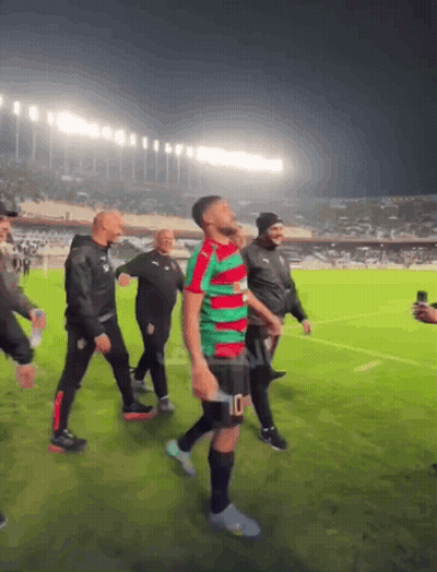 Man In Green Red Jersey Number 10 Shorts GIF