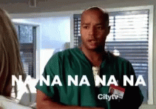 Man In Green Scrub By Window Saying Nana Na Na Na GIF
