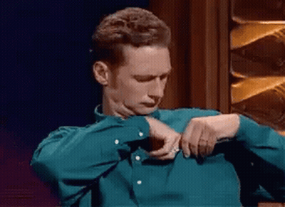 Man In Green Shirt Adjusting Shirt GIF