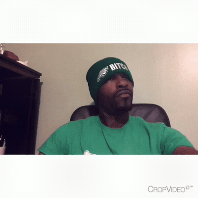 Man In Green Shirt And Beanie Saying Bitch GIF