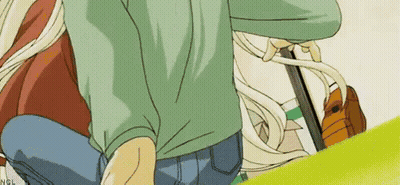 Man In Green Shirt And Blue Jeans Kneeling Next To Blonde Girl GIF