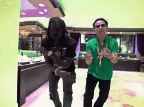 Man In Green Shirt And Man In Black Shirt GIF
