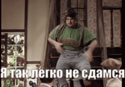 Man In Green Shirt And Striped Pants With Foreign Caption GIF