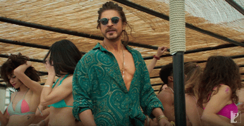 Man In Green Shirt And Sunglasses In Crowd Of Women GIF