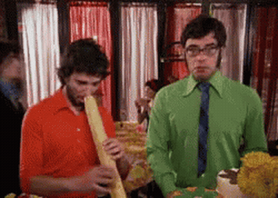 Man In Green Shirt And Tie Smoking Cigarette GIF