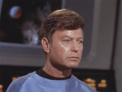 Man In Green Shirt Before R.I.P. Sign GIF