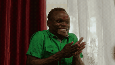 Man In Green Shirt Clapping Hands Red Curtain GIF