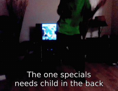 Man In Green Shirt Dancing In Front Of TV The One Specials Needs Child GIF