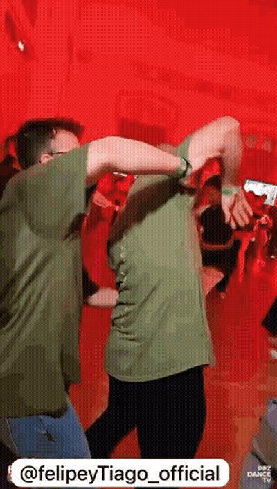Man In Green Shirt Dancing With Another Man GIF