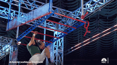 Man In Green Shirt Doing Ninja Warrior GIF