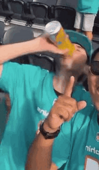 Man In Green Shirt Drinking Can And Thumbs Up GIF