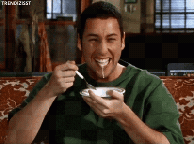 Man In Green Shirt Eating And Smiling GIF
