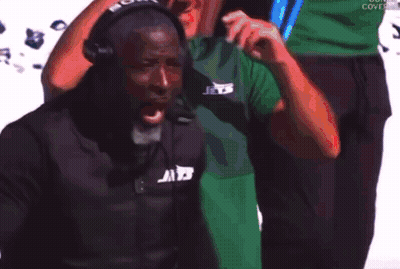 Man In Green Shirt Holding Blue Lights GIF