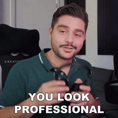 Man in Green Shirt Holding Headphones Says You Look Professional
