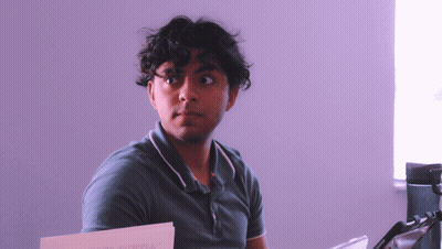 Man In Green Shirt Holding I'm Sorry Note GIF