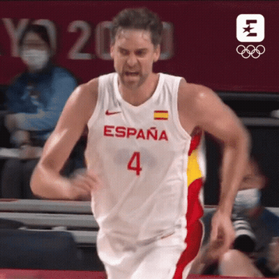 Man In Green Shirt Holding Red Card In Crowd GIF