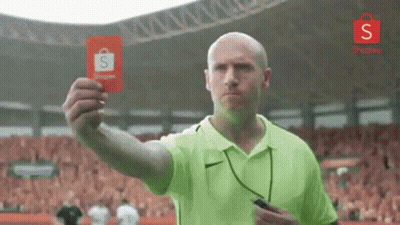 Man In Green Shirt Holding Red Card To Crowd GIF