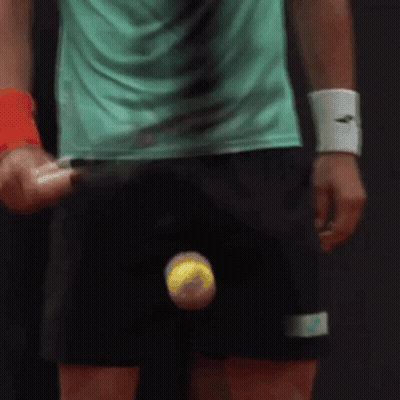 Man In Green Shirt Holding Tennis Racket And Ball GIF