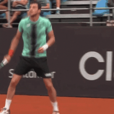 Man In Green Shirt Holding Tennis Racquet GIF