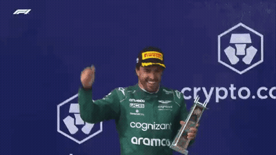 Man In Green Shirt Holding Trophy GIF