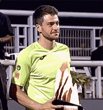 Man In Green Shirt Holding Trophy With HC Sticker GIF