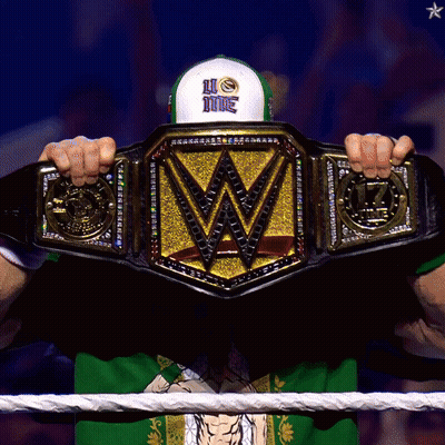 Man In Green Shirt Holding Wrestling Championship Belt GIF