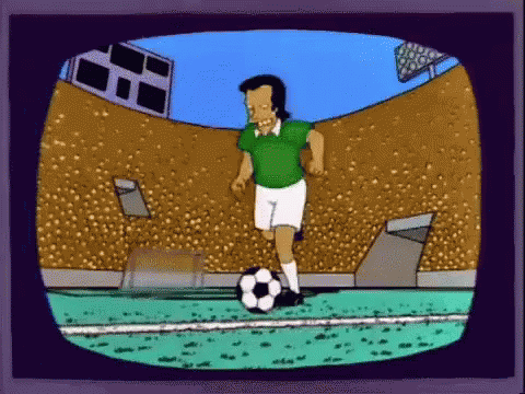 Man In Green Shirt Kicking Soccer Ball GIF