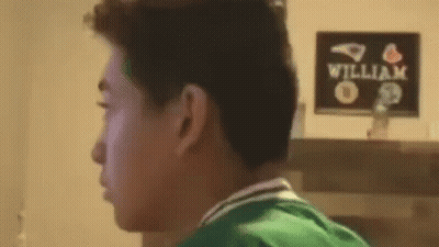 Man In Green Shirt Looking At William Sign GIF