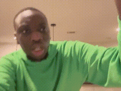 Man In Green Shirt Making A Face GIF