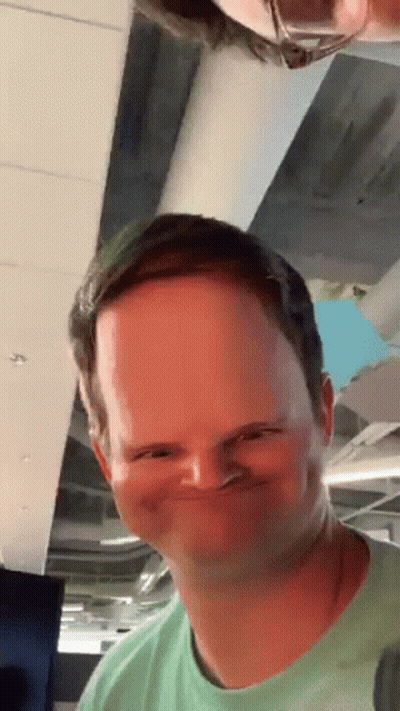 Man In Green Shirt Making Funny Face GIF