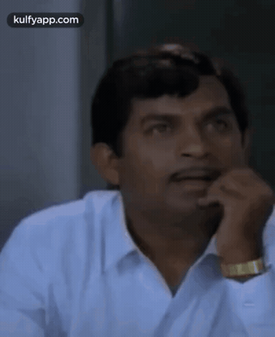 Man In Green Shirt Making Funny Face GIF