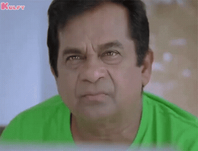 Man In Green Shirt Making Funny Face GIF