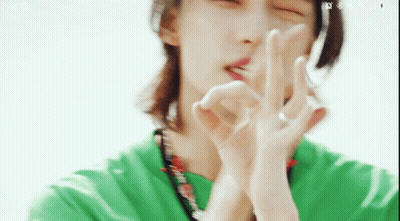 Man In Green Shirt Making Peace Sign GIF