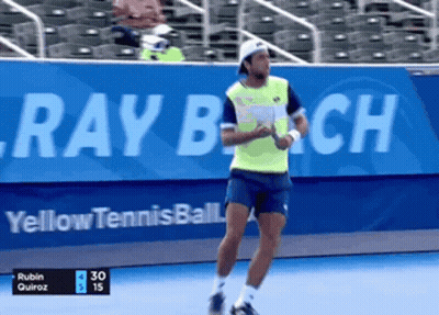 Man In Green Shirt Playing Tennis At Ray Beach GIF