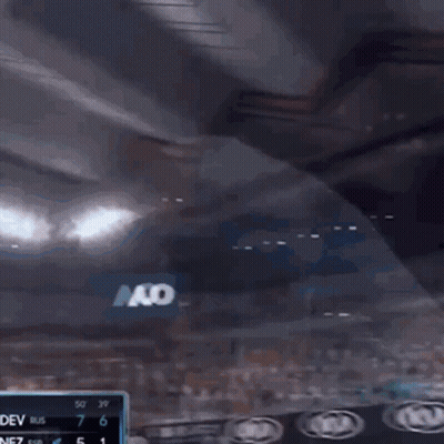 Man In Green Shirt Playing Tennis GIF