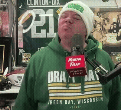 Man In Green Shirt Saying Green Bay Wisconsin Singing Into Kwik Trip Microphone GIF