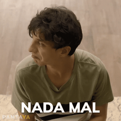 Man in Green Shirt Saying Nada Mal