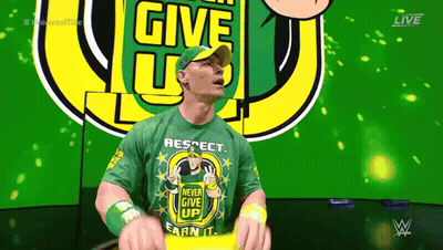 Man In Green Shirt Saying Never Give Up GIF