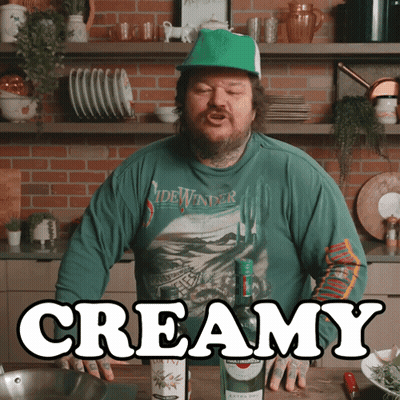 Man In Green Shirt Saying Sidewinder In Front Of Creamy Bottle GIF