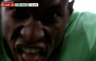 Man In Green Shirt Screaming At Premier League Scoreboard GIF