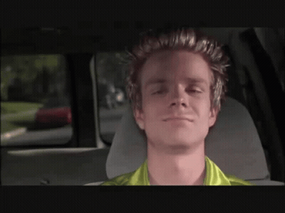 Man In Green Shirt Sitting In Car Eyes Closed GIF