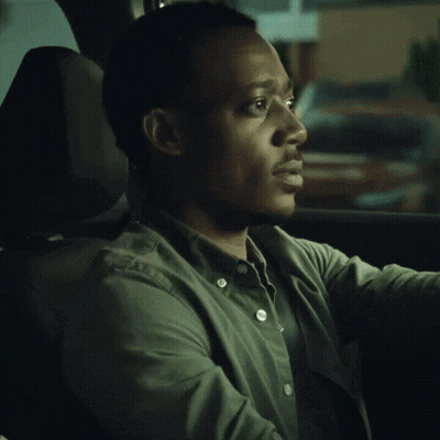 Man In Green Shirt Sitting In Car GIF