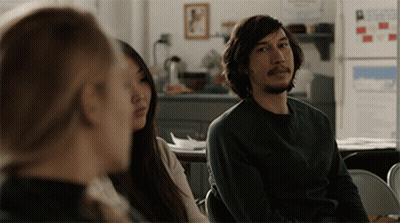 Man In Green Shirt Sitting In Front Of Woman GIF