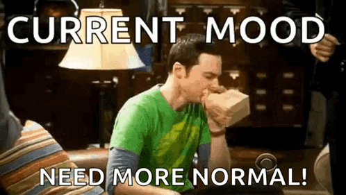 Man In Green Shirt Sitting On Couch With Bag In Mouth GIF