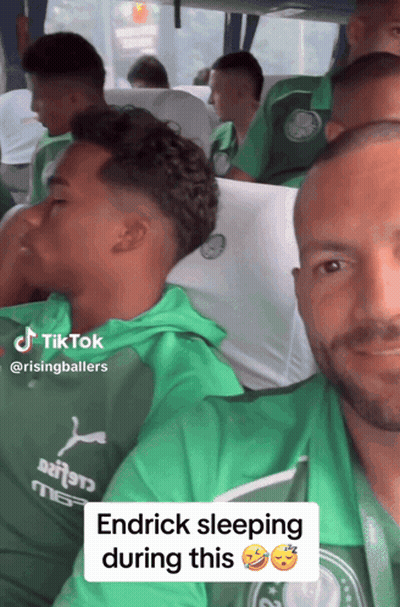 Man In Green Shirt Sleeping On Bus With Others GIF
